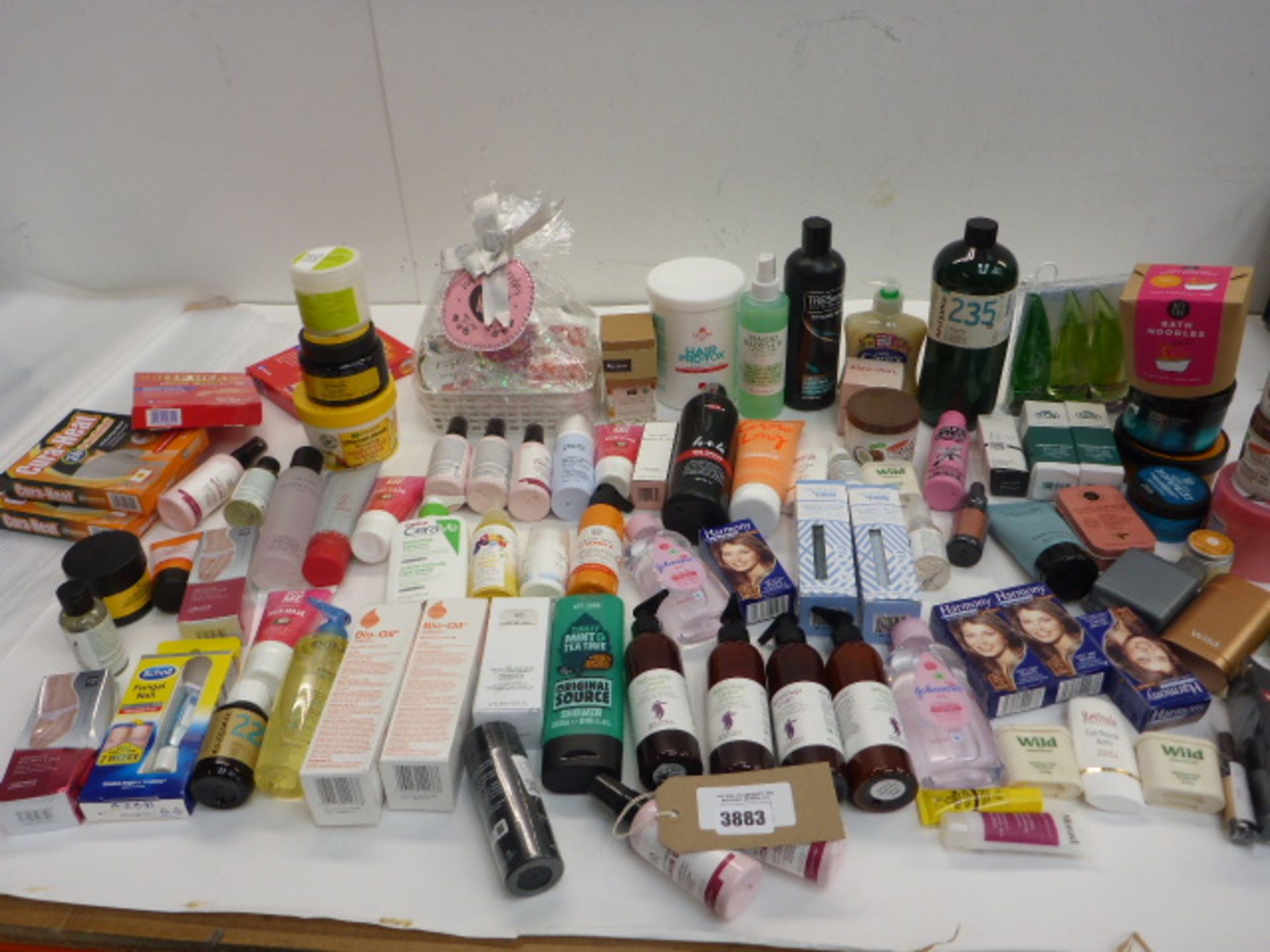 Large bag of toiletries including pain relief, reflexology cream, hair products, shower wash,