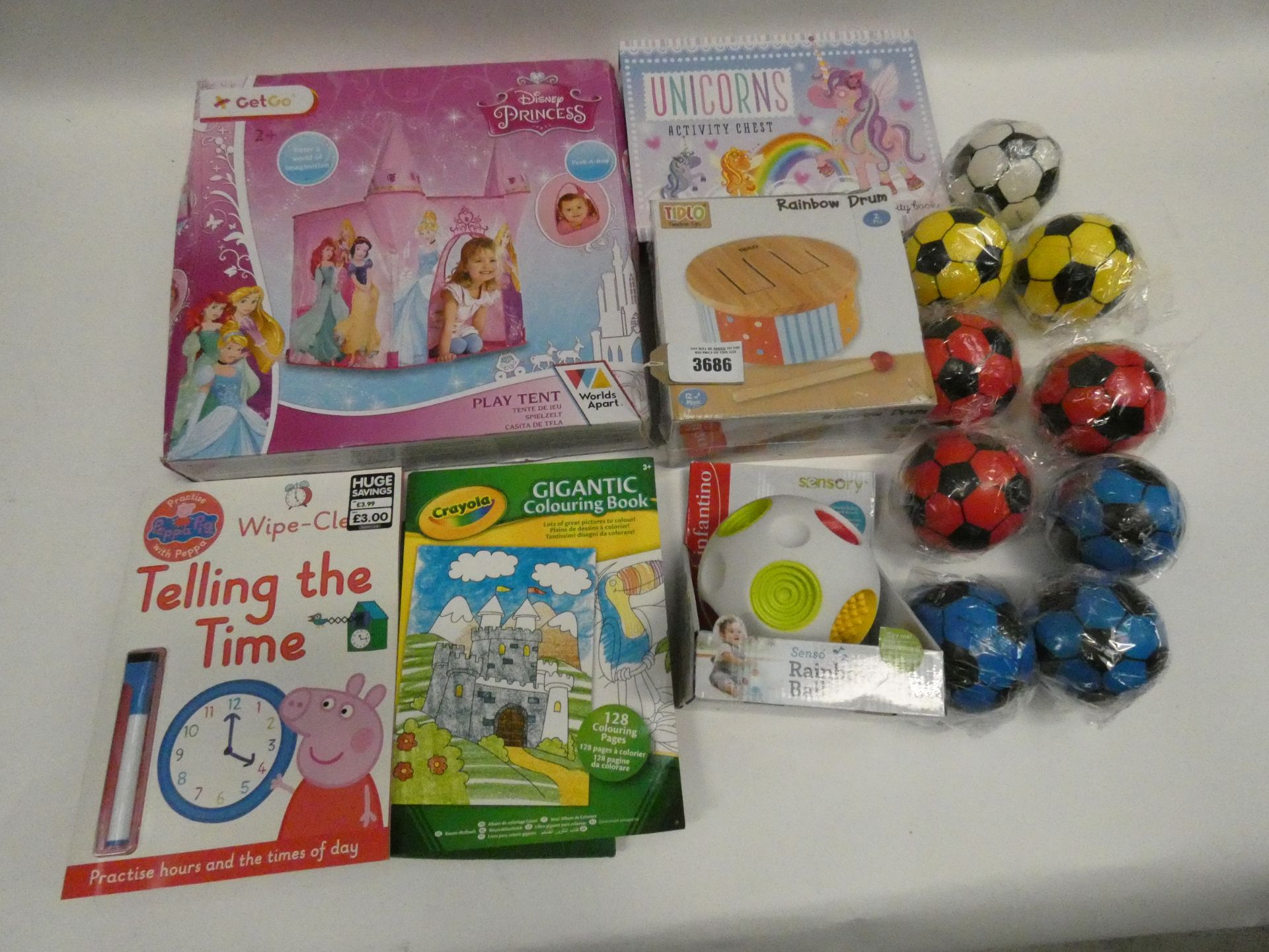 Bag containing quantity of children's toys and mini foam footballs