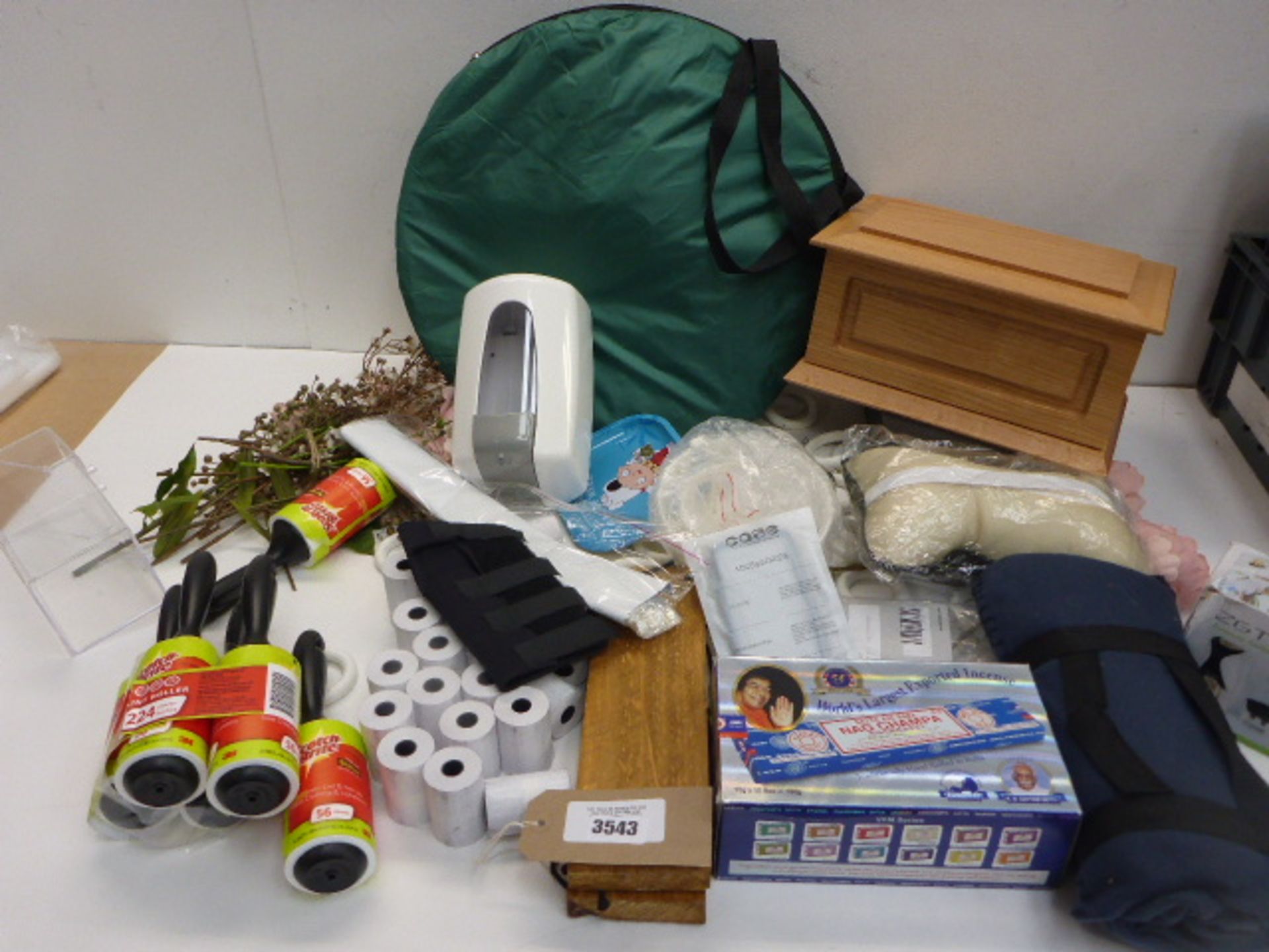 Large bag of household sundries including wooden box, incense, toothpaste dispenser, picnic blanket,