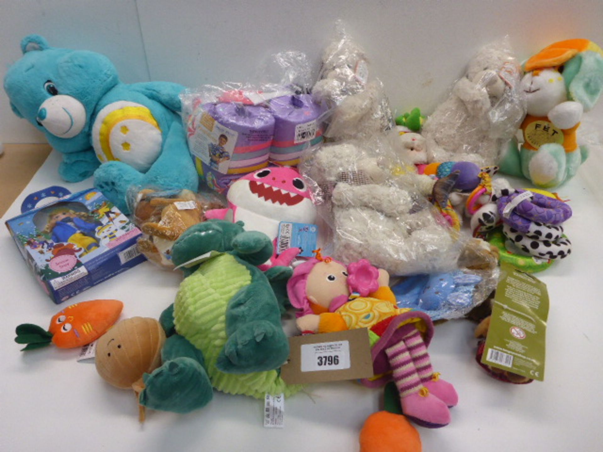 Selection of soft cuddly toys and dolls