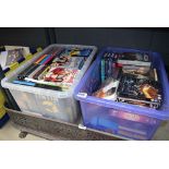 2 boxes containing a large quantity of DVDs