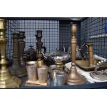 Cage containing quantity of measures plus brass candlesticks and silver plated teapots