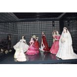 Cage containing Royal Worcester coal port and Royal Doulton figures of ladies
