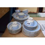 Quantity of pastel blue and gilt glazed Doulton crockery