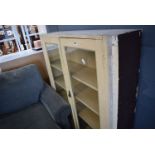 Cream painted glazed double door bookcase with drawers under