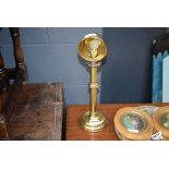 Brass candlestick with storm shade
