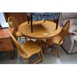 Circular beech table with 4 stickback chairs