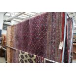 (27) Iranian multicoloured carpet with red border