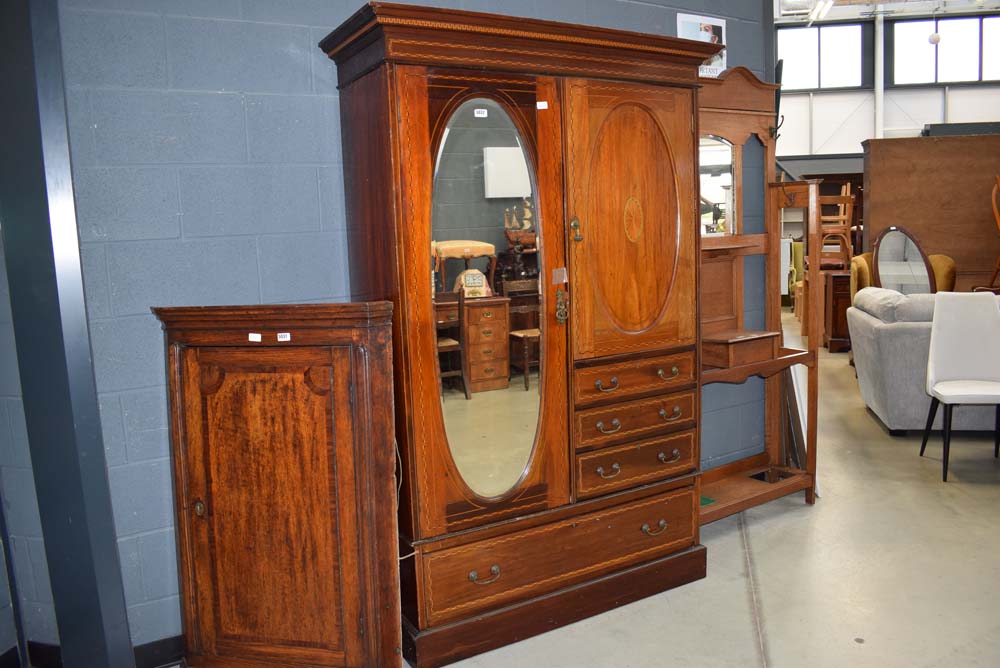 Edwardian mahogany strung and inlaid compaction with mirrored door