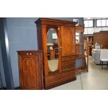 Edwardian mahogany strung and inlaid compaction with mirrored door