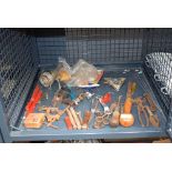 Cage containing pruning knives and tools
