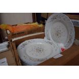 2 boxes containing floral patterned crockery