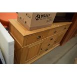 Oak sideboard with central drawers, cupboards to the side