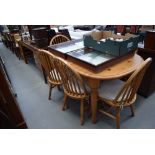 Pine extending dining table plus 6 stickback chairs