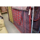 14 - Red Bokhara carpet, 3 x 3.5m