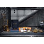 Cage containing spark plugs, watches and watch parts