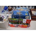 Stack of 7 jigsaw puzzles