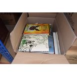 4 boxes containing reference books and novels
