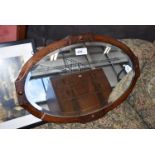 Oval bevelled mirror in oak frame and a print with beer barrels in lane