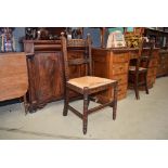 Pair of rush seated oak framed kitchen chairs