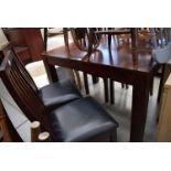 Dark wood extending dining table plus 4 matching chairs