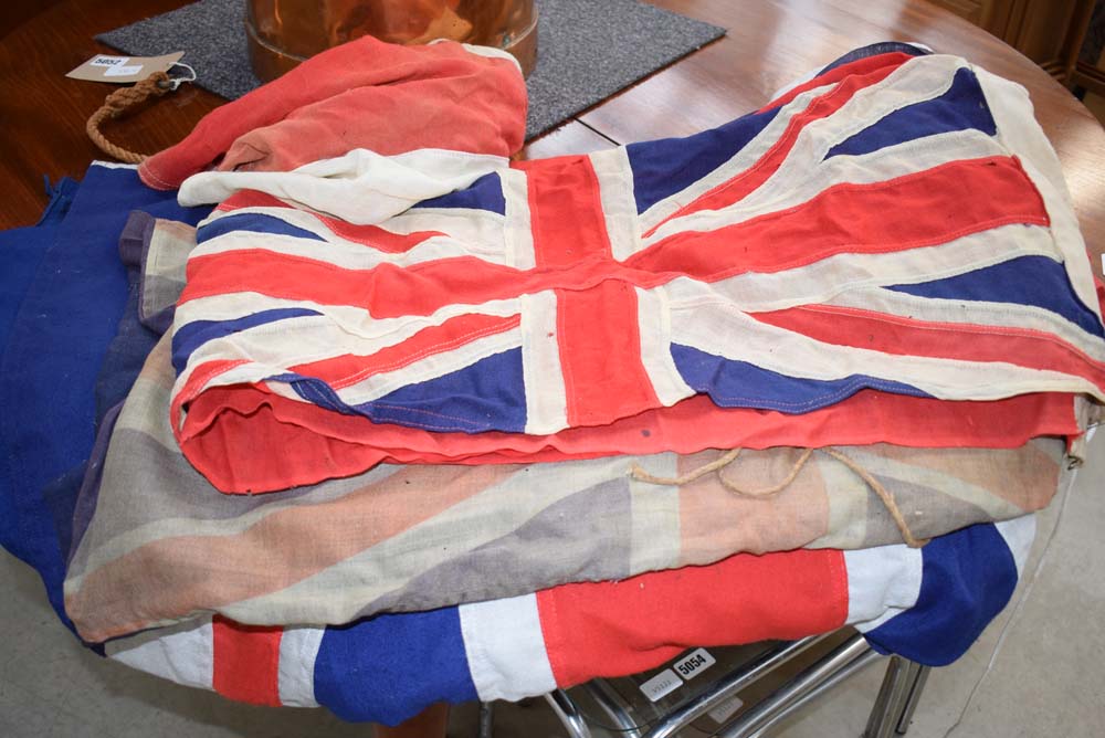 Three union jacks plus one other flag