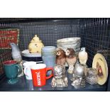 Cage containing ornamental owls and other birds plus coffee mugs and crockery