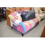 Patchwork two seater sofa with a quantity of cushions