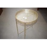 Circular metal occasional table with folding base