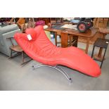 Red leather effect lounger chair on metal base
