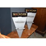 Two Macadam metal stands