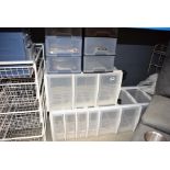 A quantity of plastic and wirework storage drawers