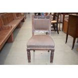 Carved oak dining chair with brown upholstery