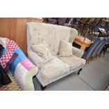 Brown floral fabric wingback two seater sofa