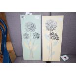 A pair of modern wall hangings depicting flowers