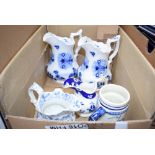A box of blue and white water jugs