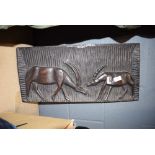 Carved African wall hanging with antelope