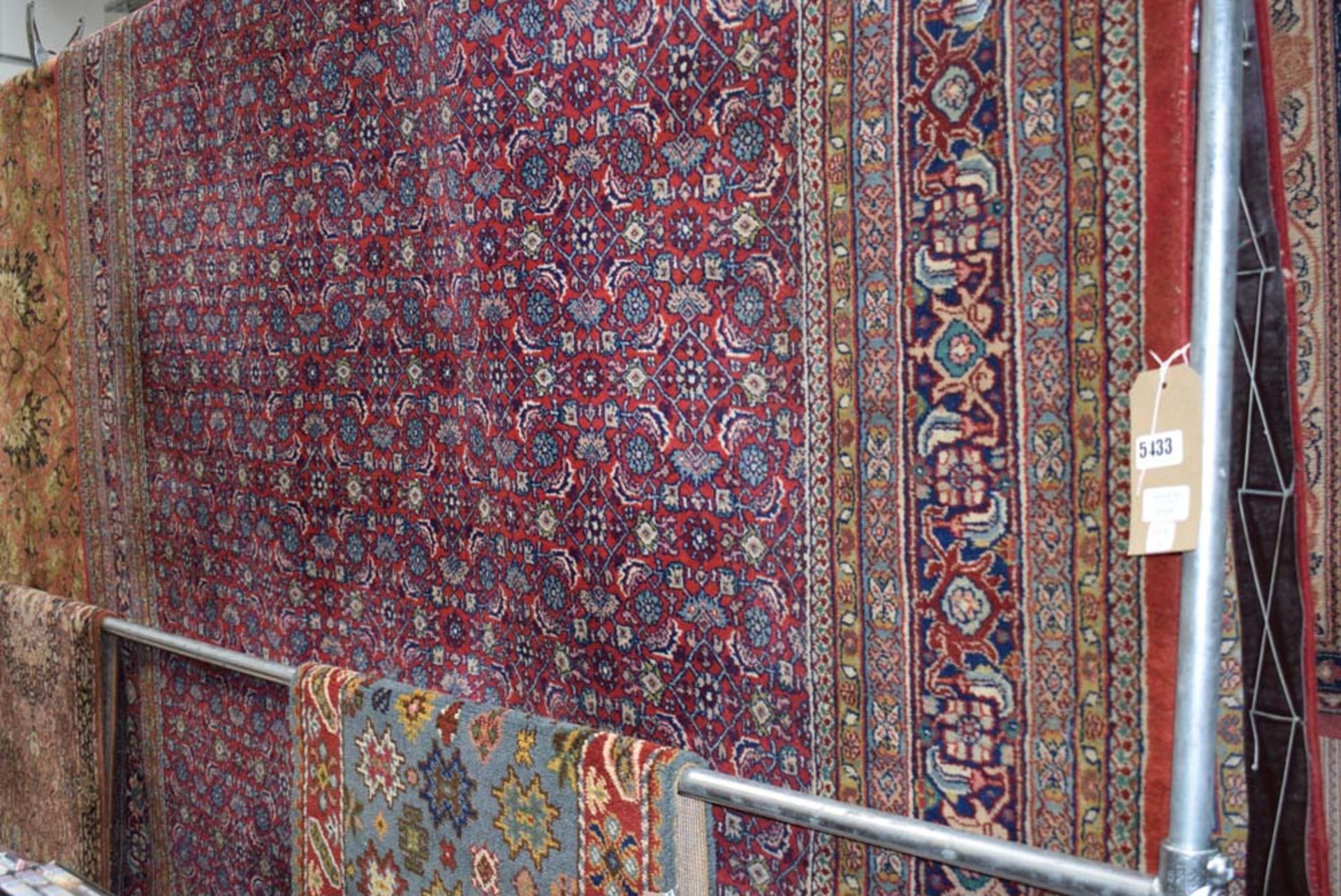 (16) A large red floral carpet