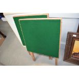 A pair of folding card tables