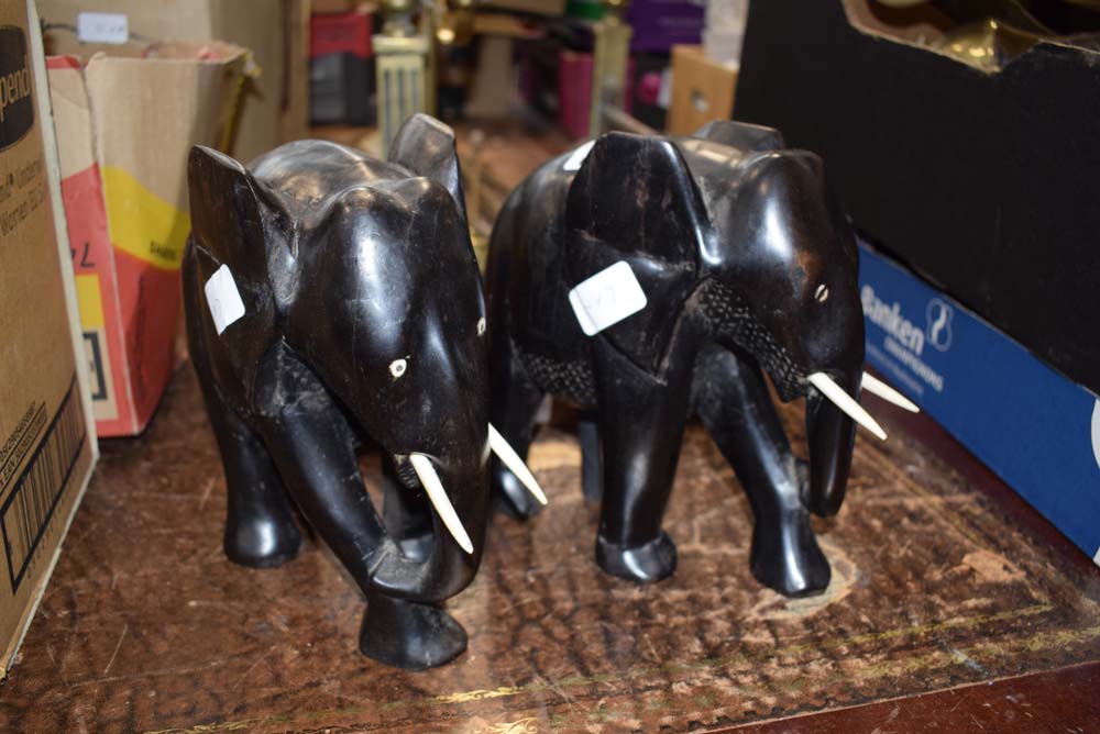 2 carved wooden elephants