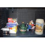 Cage containing CDs and cartridge ink plus novelty teapots and a beer mug