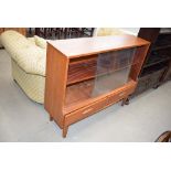 Teak bookcase with glazed sliding doors and two drawers under