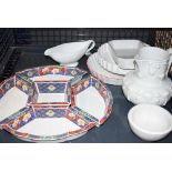 5649 - Cage containing gravy boat and waterjug plus entree dish and flan dishes