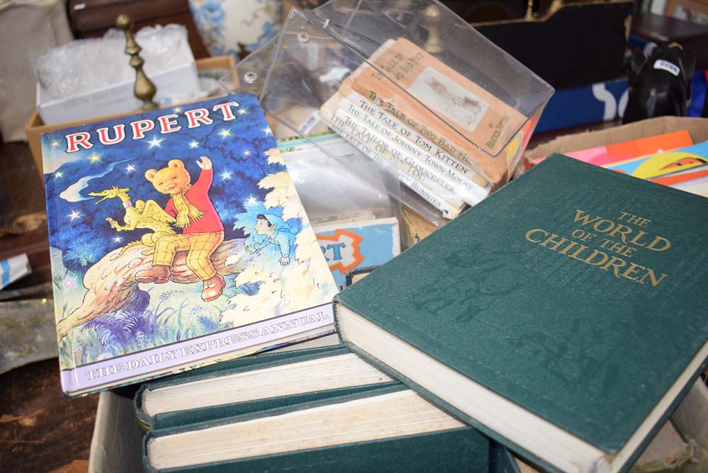 Box containing Beatrix Potter books, Rupert annuals and 'The World of Children' reference books