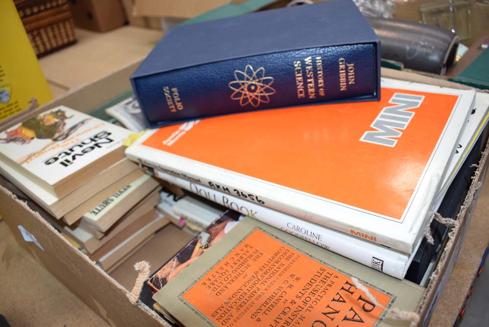 A box of reference books and novels