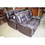 Pair of black leather effect electric reclining two seater sofas