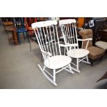 A pair of cream painted stickback rocking chair