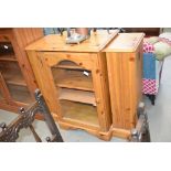 Glazed pine hifi cabinet with CD racks to the side