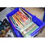 A box of annuals and books