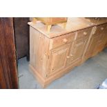 Pine sideboard with two drawers over two doors